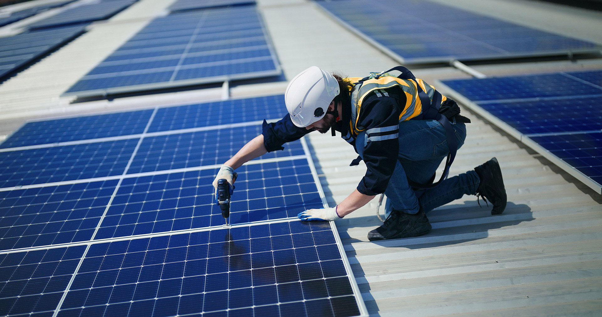 Contractor servicing solar panels